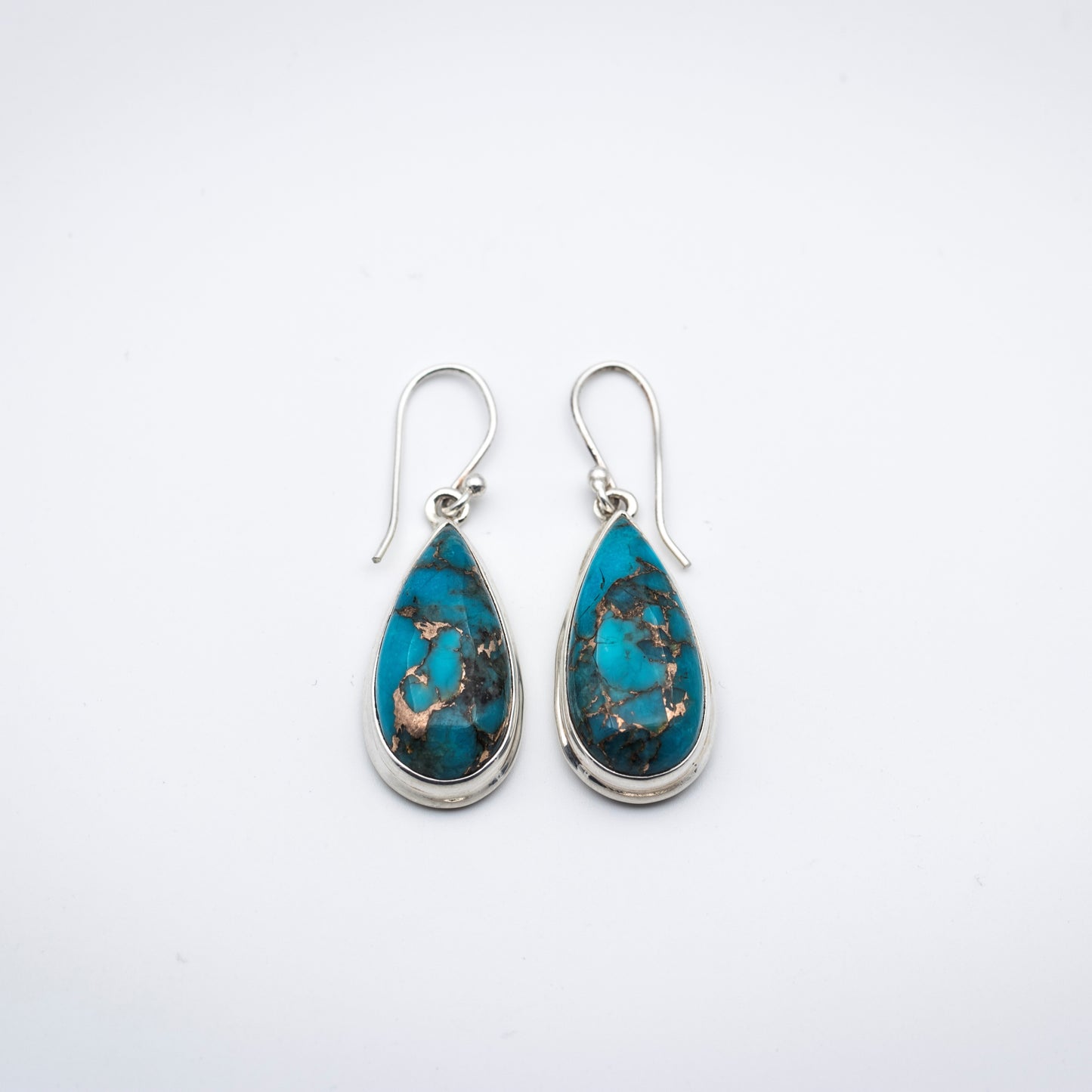 Blue Copper Turquoise Silver Earrings on a gray surface