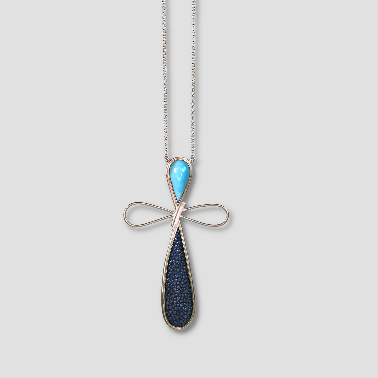 Larimar Stingray Skin Dragonfly Pendant on a gray surface
