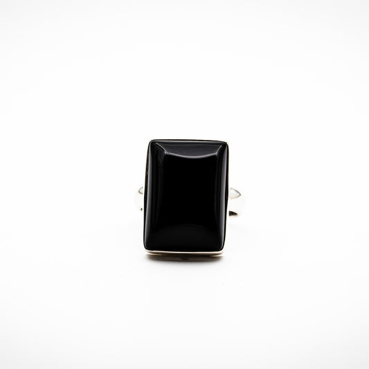 A black onyx ring on a white backgorund