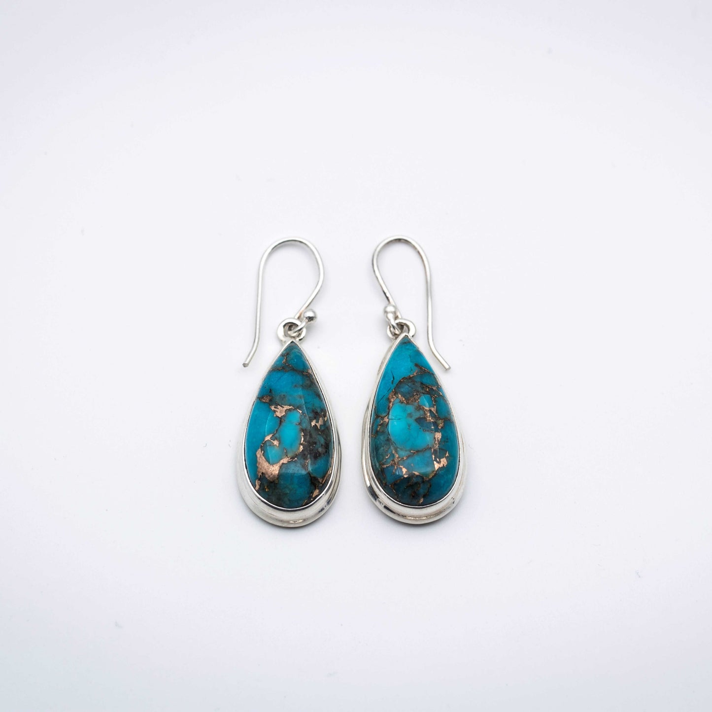 Blue Copper Turquoise Silver Earrings on a gray surface