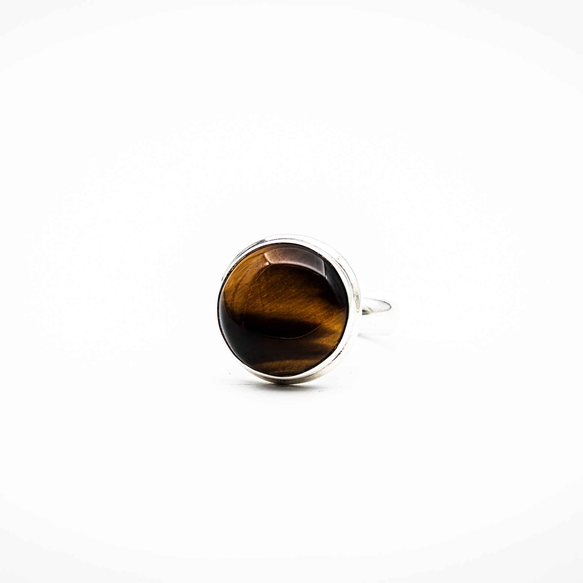 Yellow Tiger Eye on the white surface