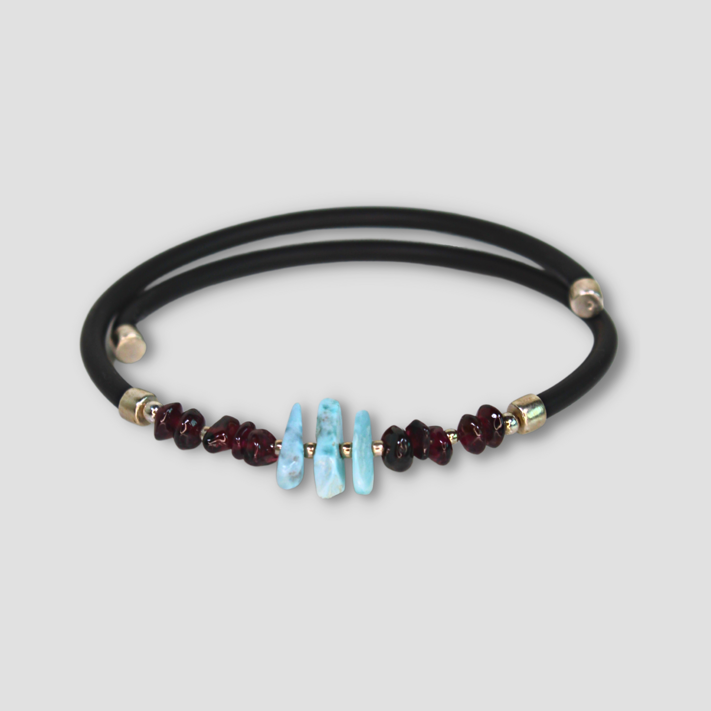 Larimar Garnet Leather Cord Bracelet on a gray surface