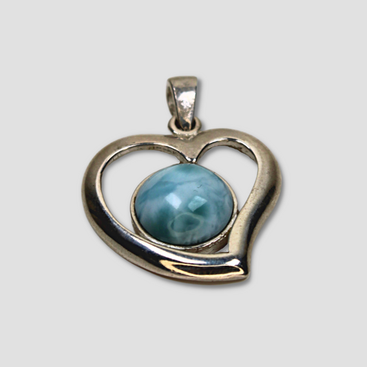 Larimar Heart Rhodium Silver Pendant on a gray surface