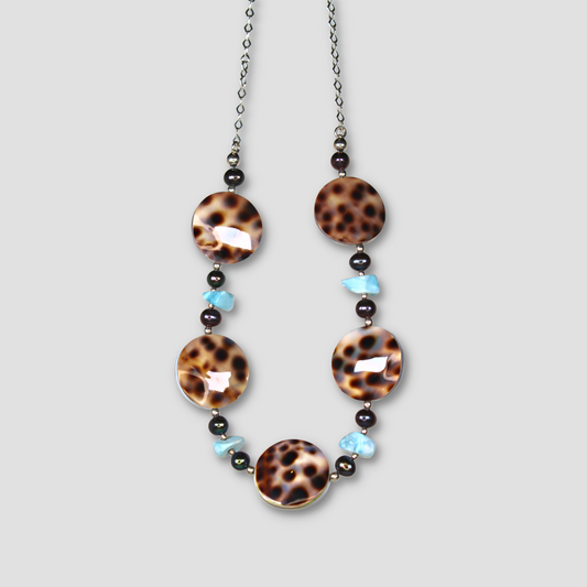 Light Blue and Brown Larimar & Abalone Necklace on a gray surface