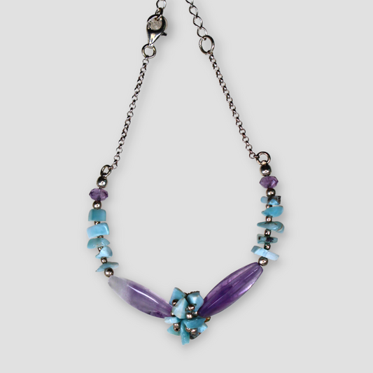 Purple and Light Blue Larimar & Amethyst Bracelet on a gray surface