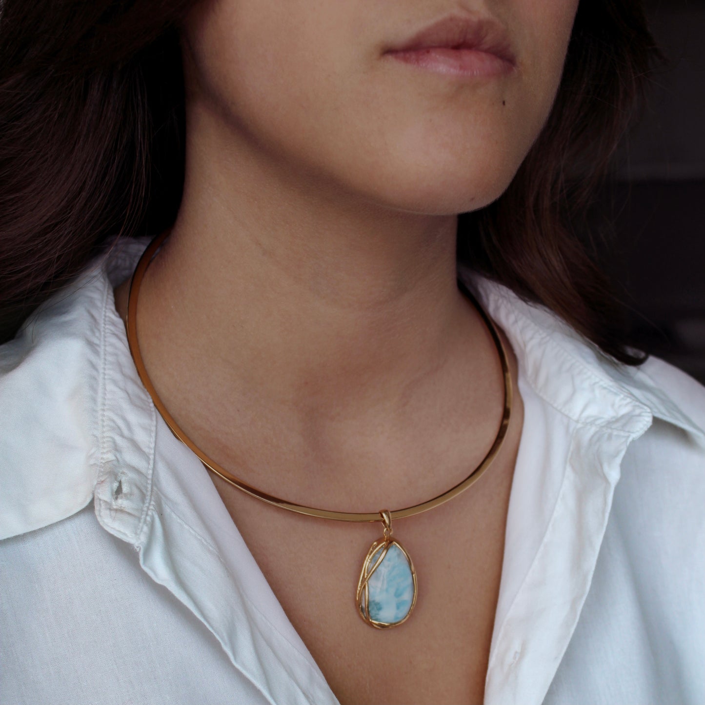 A woman wearing Larimar Gold Plated Necklace