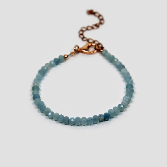 Blue Aquamarine Faceted Bracelet on a gray surface