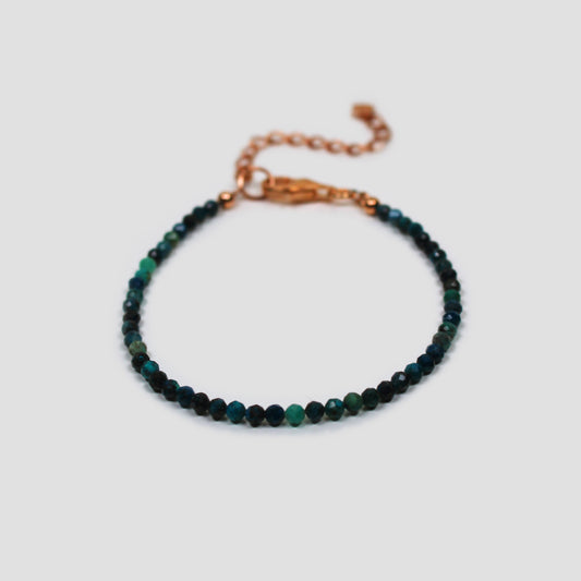 Blue Chrysocolla Faceted Bracelet on a gray surface