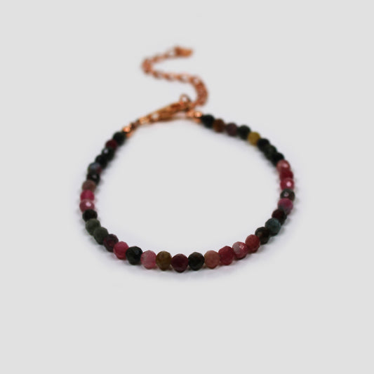 Colourful Tourmaline Faceted Bracelet on a gray surface
