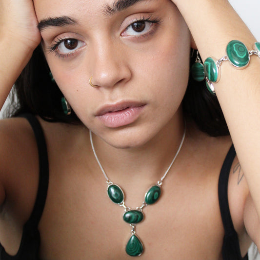 A woman wearing Malachite Silver Bracelet and Necklace 