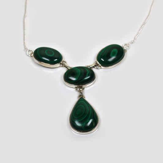 Green Malachite Silver Necklace on a gray surface