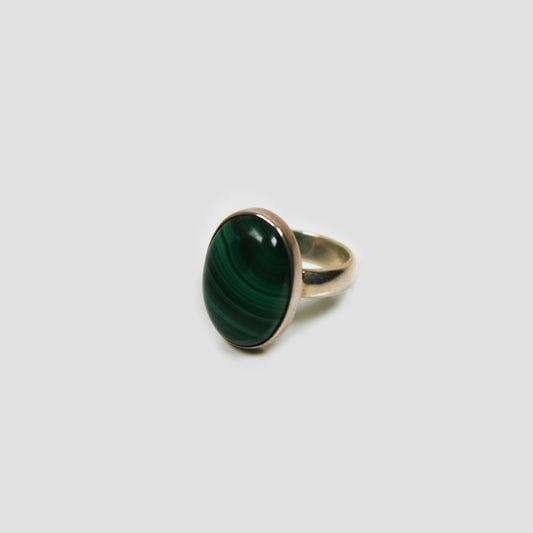Green Malachite Silver Ring on a gray surface