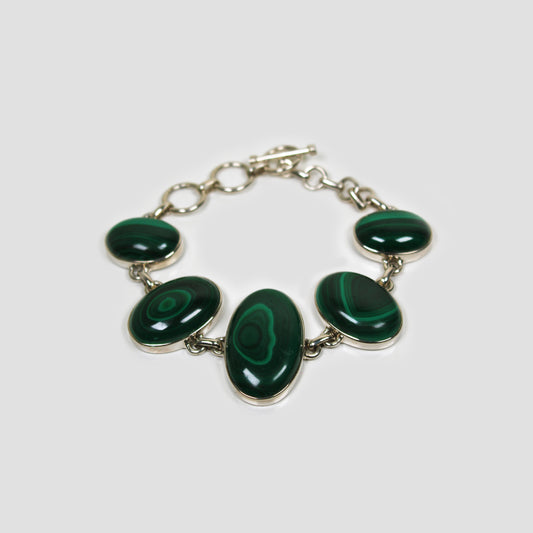 Green Malachite Silver Bracelet on a gray surface