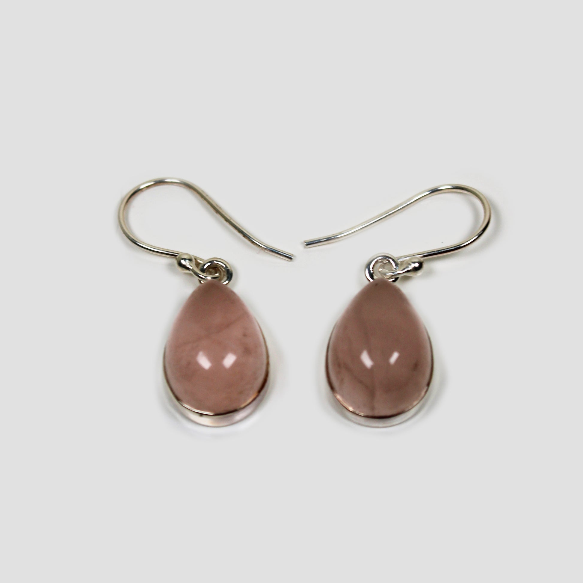 Rose quartz Silver Earrings on a gray surface