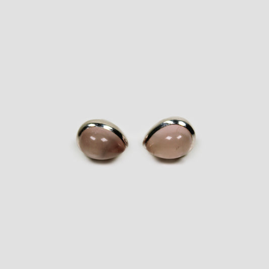 Rose quartz Silver Stud Earrings on a gray surface