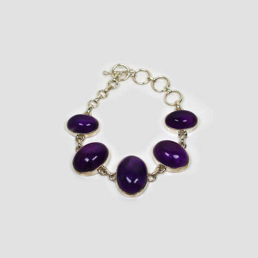 Purple Amethyst Sterling Silver necklace on a gray surface