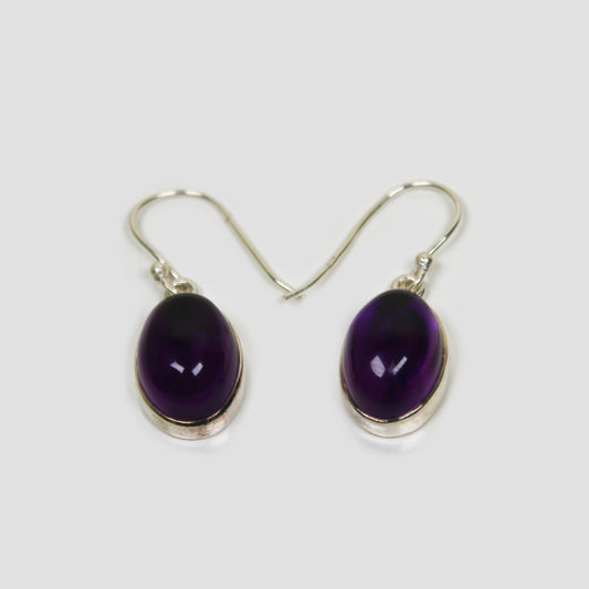 Purple Amethyst Silver earrings on a gray surface