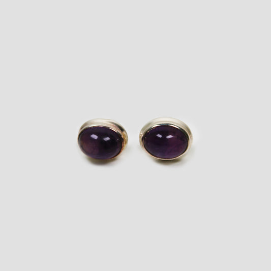 Purple Amethyst Silver Earrings on a gray surface
