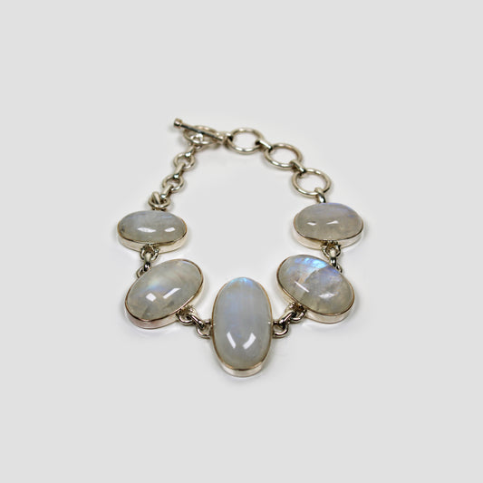 White Moonstone Silver Bracelet on a gray surface