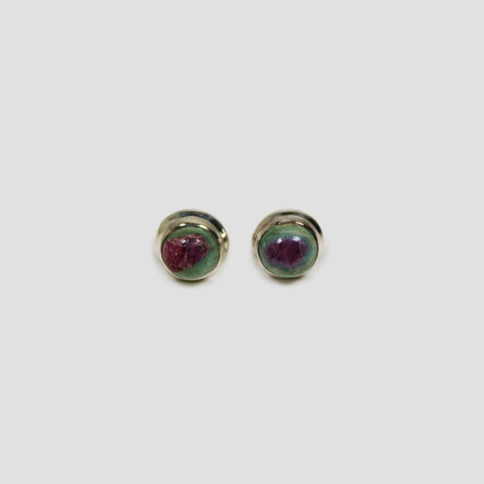 Ruby Fuchsite Stud Earrings on a gray surface