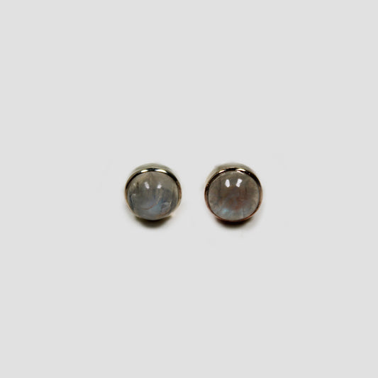 Moonstone Stud Earrings on a gray surface
