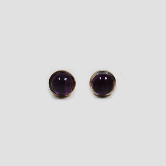 Purple Amethyst Silver Earrings on a gray surface