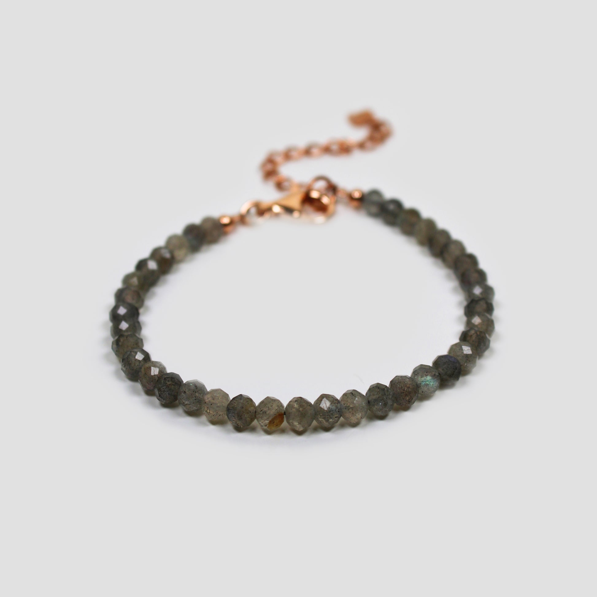 Green Labradorite Faceted Bracelet on a gray surface