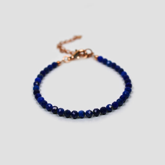 Blue Lapis Lazuli Faceted Bracelet on a gray surface