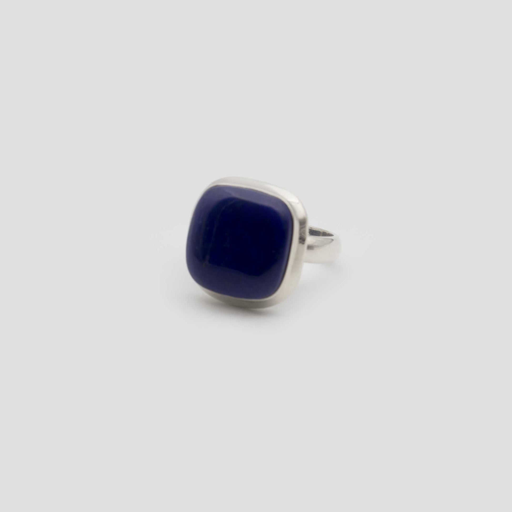 Blue Lapis Lazuli Silver Square Ring on a gray surface