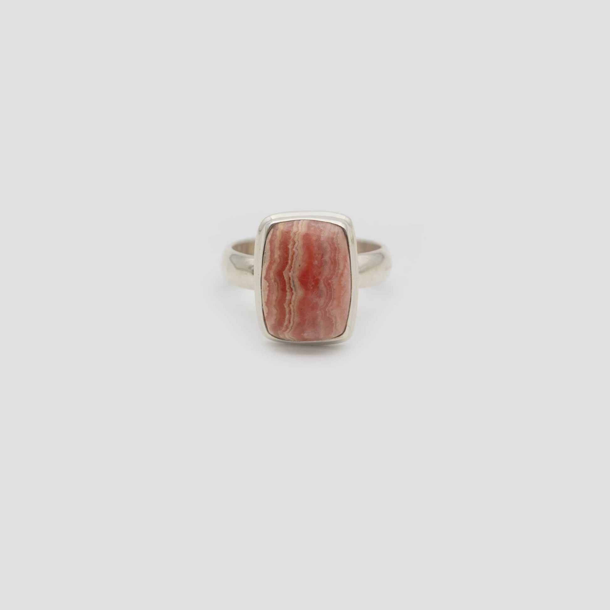 Rose Rhodochrosite Silver Square Ring a gray surface