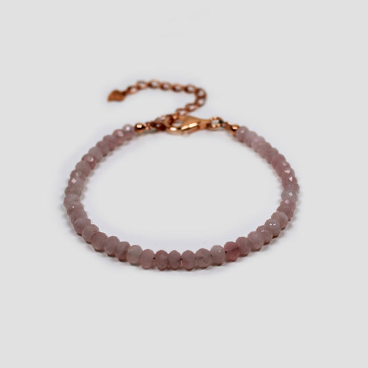 Rose Quartz Faceted Bracelet on a gray surface